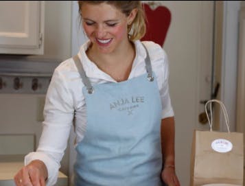chef cooking in a blue apron