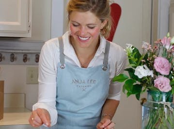 chef cooking in a light blue apron