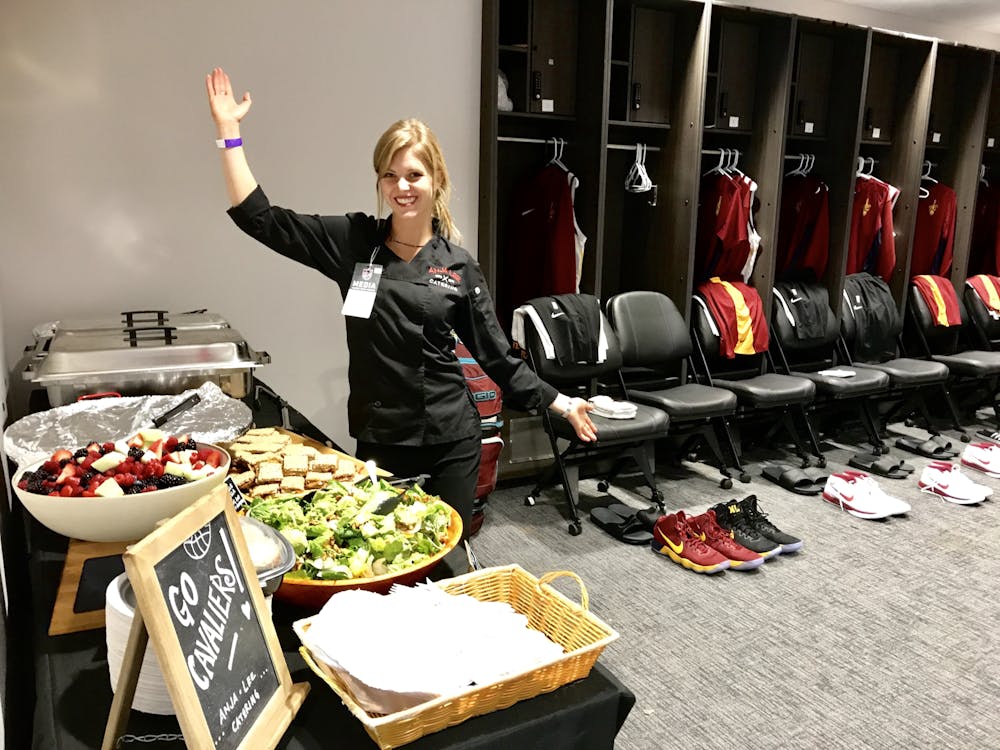 Chef Anja in a basketball locker room with a buffet of food